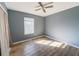 Cozy bedroom with ceiling fan and window at 5912 Jacobs Rd, Acworth, GA 30102