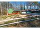 Ranch home with green siding, deck, and detached garage at 5912 Jacobs Rd, Acworth, GA 30102