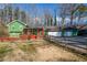 Green house with double garage and a large deck at 5912 Jacobs Rd, Acworth, GA 30102