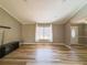 Living room with wood look floors and large window at 5912 Jacobs Rd, Acworth, GA 30102