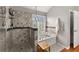 Relaxing bathroom featuring a walk-in shower, a soaking tub, and stylish tile work at 6310 Fox Creek Dr, Cumming, GA 30040