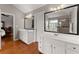 Modern bathroom with dual vanities, a large mirror, and a luxurious walk-in shower at 6310 Fox Creek Dr, Cumming, GA 30040