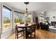 Cozy breakfast nook with hardwood floors and a view of the yard and a glimpse of the living room at 6310 Fox Creek Dr, Cumming, GA 30040