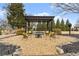 A backyard pergola with seating area and a fire pit offers an outdoor living space at 6310 Fox Creek Dr, Cumming, GA 30040