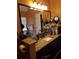 Bathroom with granite countertop and large mirror at 115 The Falls Blvd, Covington, GA 30016