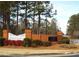 Brick entrance with white picket fence to The Falls community at 115 The Falls Blvd, Covington, GA 30016