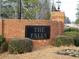 Brick entrance to The Falls community with landscaping and a sign at 115 The Falls Blvd, Covington, GA 30016