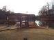 Relaxing gazebo by the lake with picnic tables at 115 The Falls Blvd, Covington, GA 30016