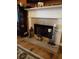 Fireplace with decorative mantel and hearth at 115 The Falls Blvd, Covington, GA 30016