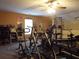 Home gym with a variety of exercise equipment at 115 The Falls Blvd, Covington, GA 30016