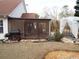 Screened porch with seating area and grill at 115 The Falls Blvd, Covington, GA 30016