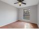 Bright bedroom with wood-look floors and ceiling fan at 1440 Teaberry Cir, Lawrenceville, GA 30044