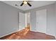 Spacious bedroom with wood-look floors and access to a hallway at 1440 Teaberry Cir, Lawrenceville, GA 30044