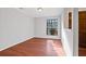 Simple dining room with wood floor and large window at 1440 Teaberry Cir, Lawrenceville, GA 30044