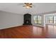 Living room with fireplace, hardwood floors, and vaulted ceiling at 1440 Teaberry Cir, Lawrenceville, GA 30044