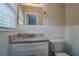 Clean bathroom with granite countertop and white tile at 1937 Windsor Sw Dr, Atlanta, GA 30311