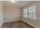 Bedroom with neutral walls, hardwood floors, and window at 1937 Windsor Sw Dr, Atlanta, GA 30311