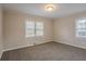 Spacious bedroom featuring neutral walls and carpet at 1937 Windsor Sw Dr, Atlanta, GA 30311