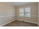 Spacious bedroom with hardwood floors and neutral decor at 1937 Windsor Sw Dr, Atlanta, GA 30311