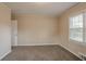 Simple bedroom with carpet flooring and neutral walls at 1937 Windsor Sw Dr, Atlanta, GA 30311