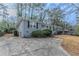 Gray brick ranch house with a driveway and mature trees at 1937 Windsor Sw Dr, Atlanta, GA 30311