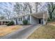 Gray brick ranch home with carport and landscaped yard at 1937 Windsor Sw Dr, Atlanta, GA 30311