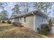 Gray brick house side view, landscaping at 1937 Windsor Sw Dr, Atlanta, GA 30311