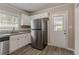 Modern kitchen with stainless steel appliances and white cabinets at 1937 Windsor Sw Dr, Atlanta, GA 30311