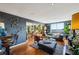 Living room with hardwood floors and mid-century furniture at 215 Piedmont Ne Ave # 1707, Atlanta, GA 30308