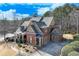 Two-story home with a three-car garage, a large backyard, and a basketball court at 2976 Cambridge Hill Dr, Dacula, GA 30019