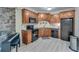 Efficient basement kitchenette with dark cabinetry at 2976 Cambridge Hill Dr, Dacula, GA 30019