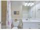 Clean bathroom with white vanity, shower, and toilet at 2976 Cambridge Hill Dr, Dacula, GA 30019