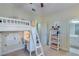 bedroom with white bunk bed and built in desk at 2976 Cambridge Hill Dr, Dacula, GA 30019