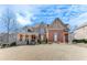 Brick two-story home with stone accents at 2976 Cambridge Hill Dr, Dacula, GA 30019