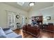 Bright home office features built-in shelving and hardwood floors at 2976 Cambridge Hill Dr, Dacula, GA 30019