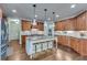 Modern kitchen with granite countertops and a large island at 2976 Cambridge Hill Dr, Dacula, GA 30019