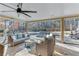 Relaxing screened porch with pool view and wicker furniture at 2976 Cambridge Hill Dr, Dacula, GA 30019