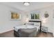 Bright bedroom featuring a comfortable queen-size bed and hardwood floors at 3490 Turner Heights Dr, Decatur, GA 30032