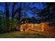 Brick house exterior at dusk with a screened porch and deck at 3490 Turner Heights Dr, Decatur, GA 30032