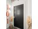 Modern apartment entry with black door and pampas grass at 1065 United Se Ave # 101, Atlanta, GA 30316