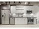 Modern kitchen with stainless steel appliances and white cabinets at 1065 United Se Ave # 101, Atlanta, GA 30316