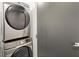 Stackable washer and dryer in a compact laundry closet at 1065 United Se Ave # 101, Atlanta, GA 30316