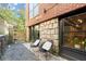 Relaxing patio area with two black chairs and a gravel pathway at 1065 United Se Ave # 101, Atlanta, GA 30316