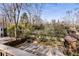 Elevated backyard view showing a shed, hardscaped area, and surrounding mature trees at 1316 North Ne Ave, Atlanta, GA 30307