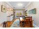 Dining area with hardwood floors, outdoor access and views of the modern kitchen at 1316 North Ne Ave, Atlanta, GA 30307