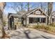 Charming craftsman-style home featuring a cozy front porch, gray brick, and inviting curb appeal at 1316 North Ne Ave, Atlanta, GA 30307