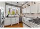 Kitchen featuring stainless appliances, a granite countertop and a mosaic tile backsplash at 1316 North Ne Ave, Atlanta, GA 30307