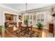 Inviting living room featuring hardwood floors, a fireplace, natural light, and an open floor plan at 1316 North Ne Ave, Atlanta, GA 30307