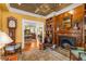 Inviting living room with hardwood floors, fireplace, built-in bookshelves, and an ornate ceiling at 1316 North Ne Ave, Atlanta, GA 30307