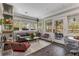 Bright sunroom living area with large windows, stylish furnishings, and slate flooring at 1316 North Ne Ave, Atlanta, GA 30307